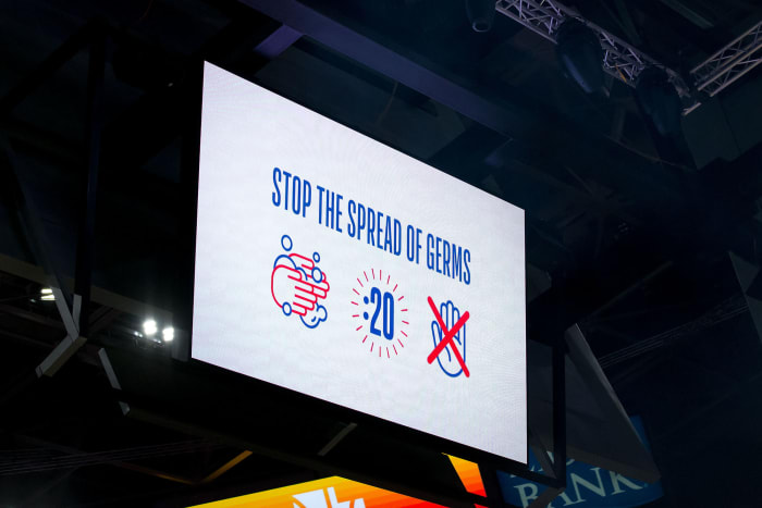 A message about germs on a screen at Vivint Smart Home Arena prior to a game between the Utah Jazz and the Toronto Raptors.